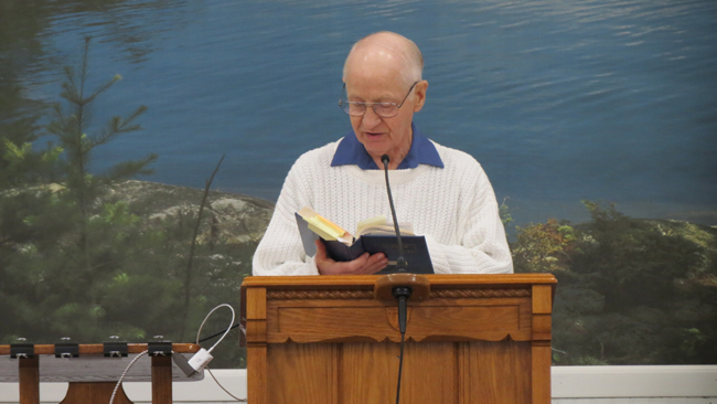 Jim Lanning, Elder at South Main Church of Christ, reads from Scripture